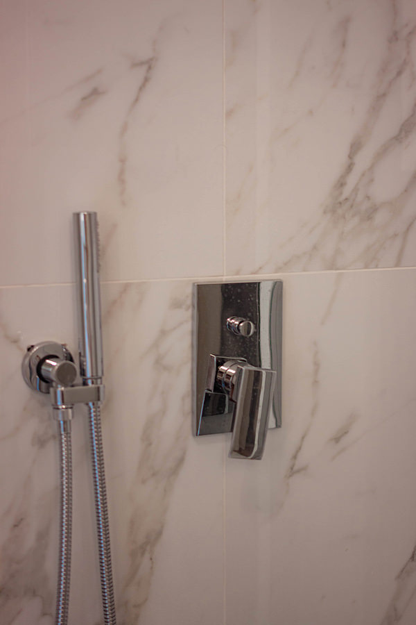 detail of stainless steel shower taps