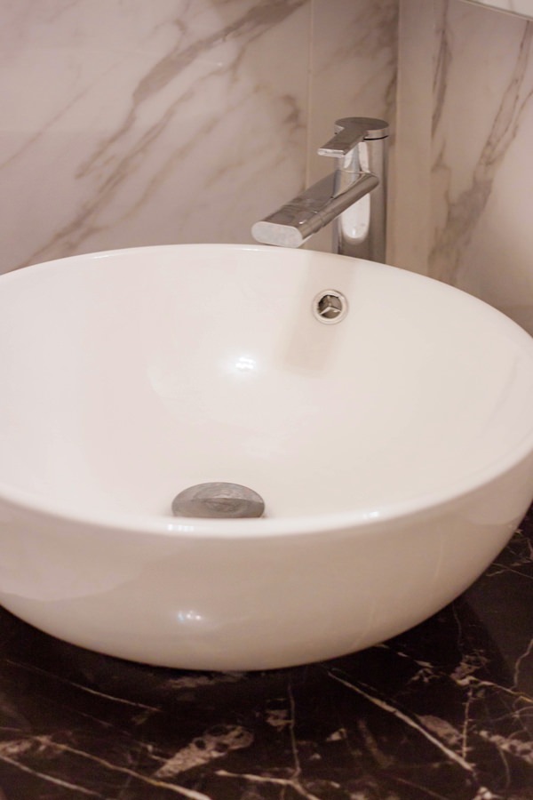 Corian countertop washbasin with marble top