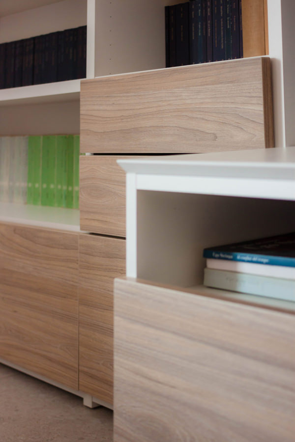 front detail of drawers in laminate wood furniture in the living area