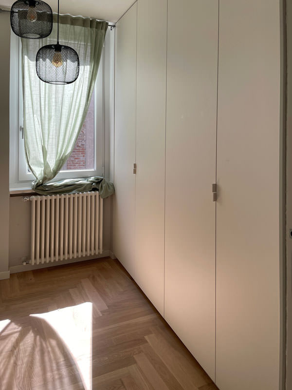 full-height wardrobe doors sheet metal handles minimal furniture