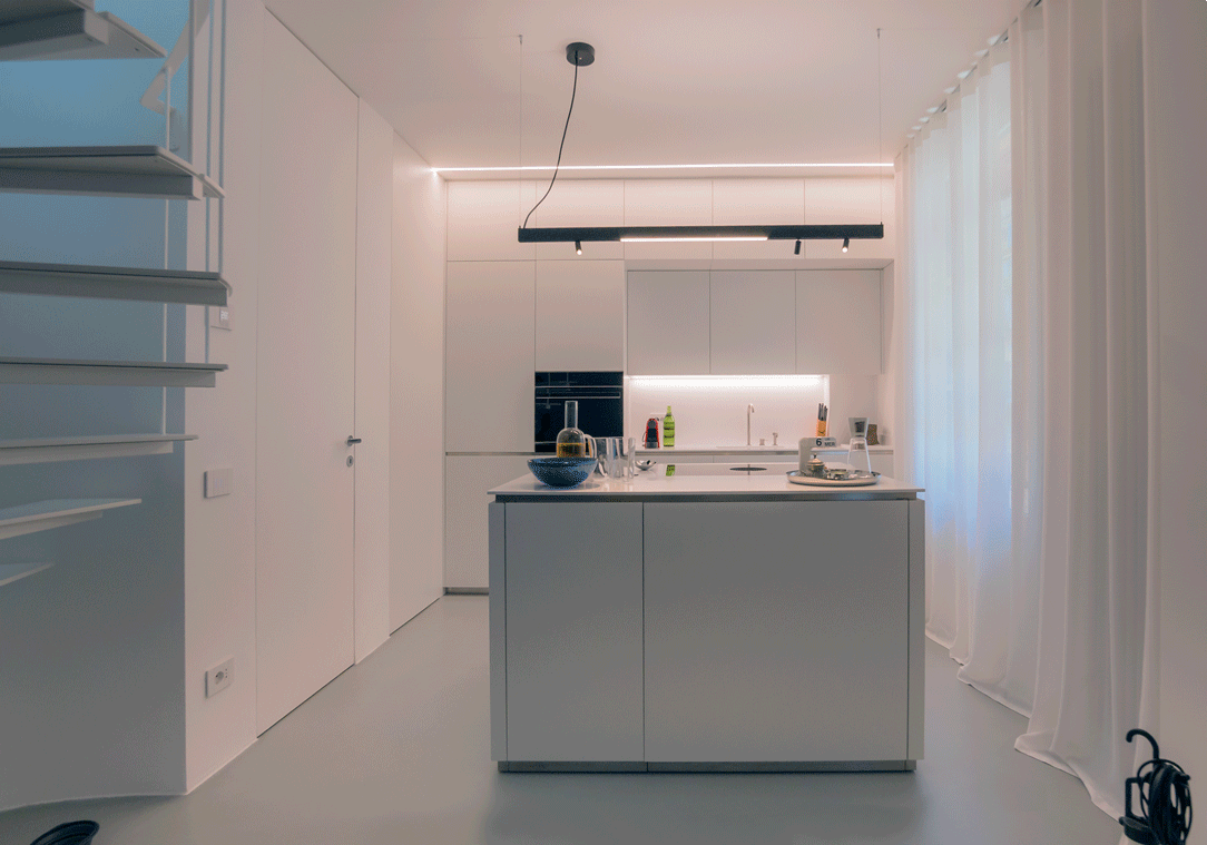 Opening doors white kitchen with island
